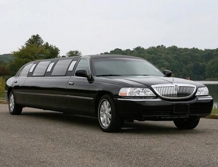 A black limo is parked in the street.