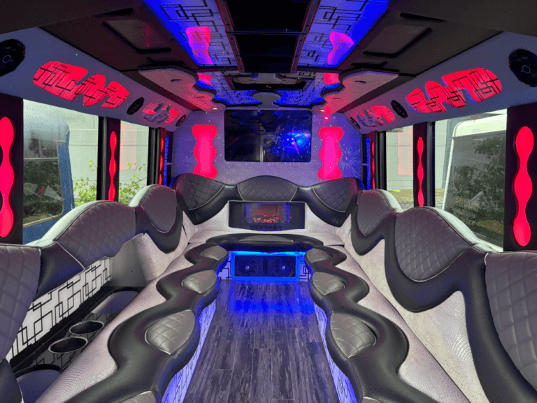 Party bus interior with colorful lights.