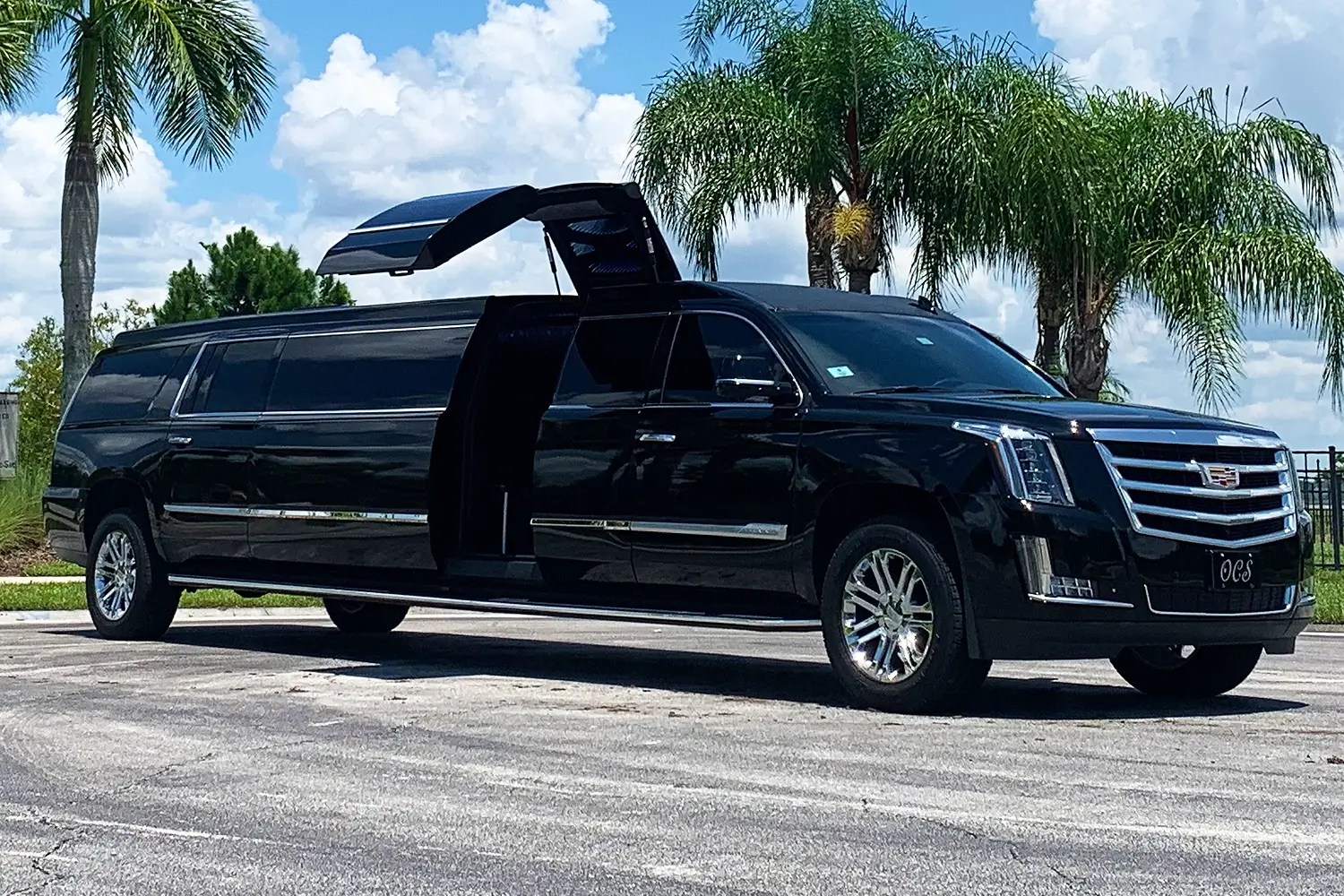 A black limo is parked on the street